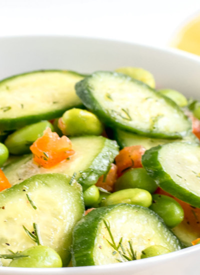 A bowl of easy cucumber salad with tomatoes.