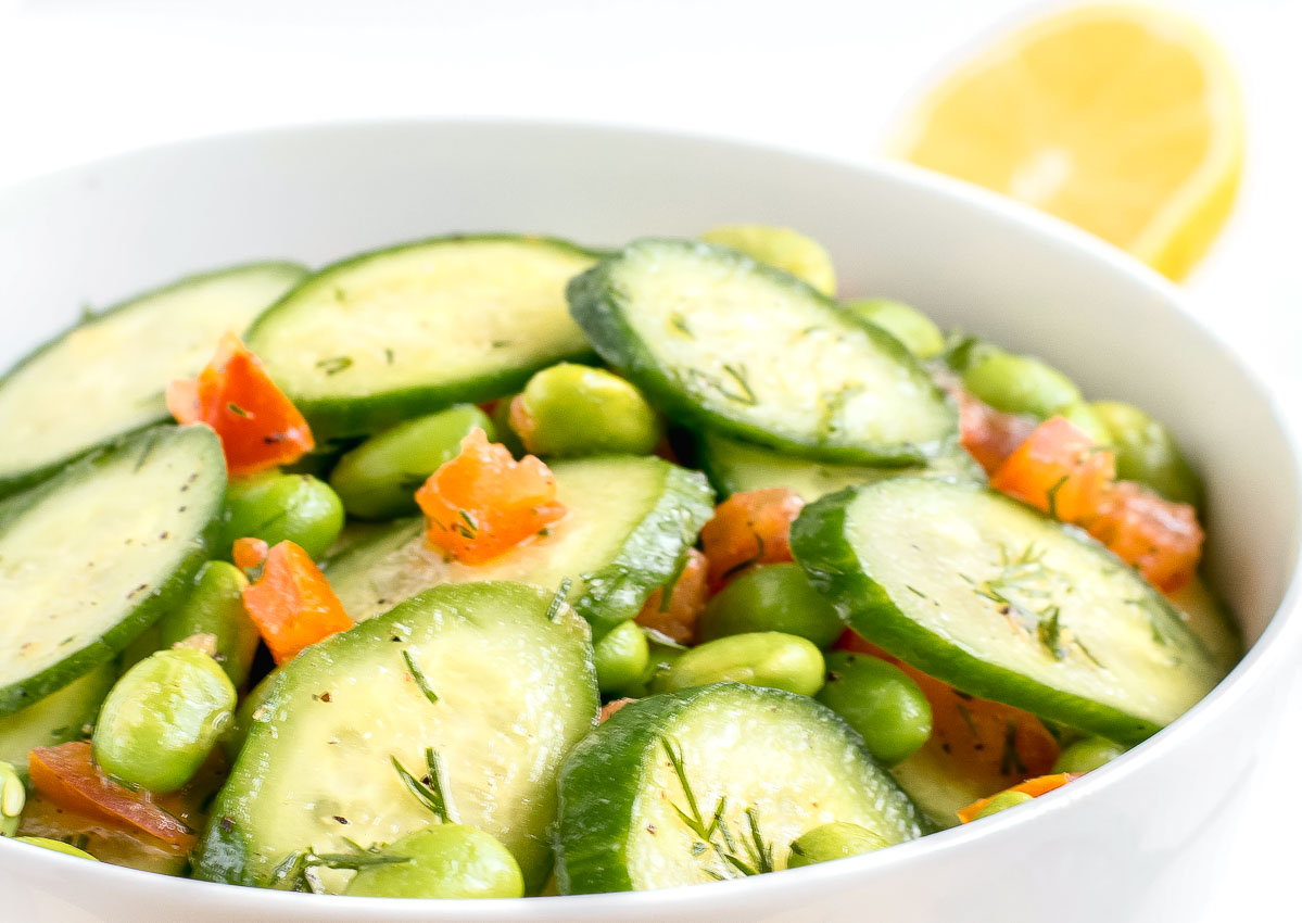 A bowl of easy cucumber salad with tomatoes. 