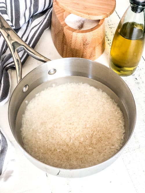 You don't need a rice cooker to make a perfectly fluffy white rice! Sharing my foolproof method to cook simple, yet deliciously fluffy white rice on stovetop and answering all your questions on how to cook rice on stovetop. #whiterice #fluffywhiterice #howtocookrice #longgrainrice