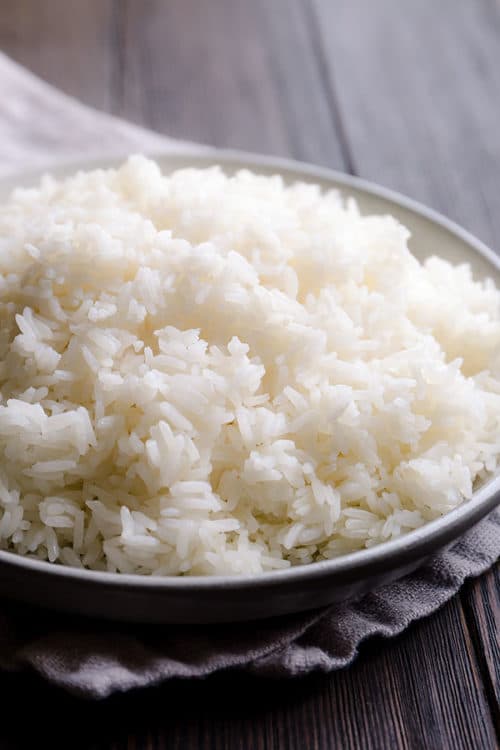 Get perfectly fluffy white rice every time. My proven method to cook long grain white rice on stovetop. You don’t need a rice cooker to make a perfectly fluffy white rice! #rice #whiterice #jasminerice #howtocookrice