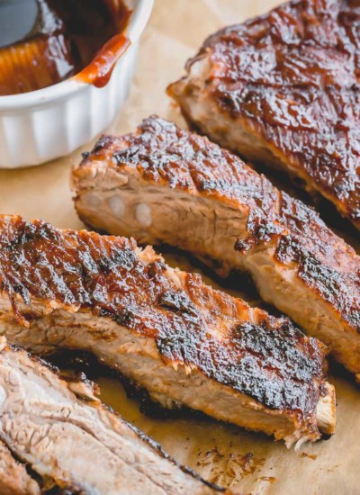 Quick and easy Instant Pot Ribs finished on the grill for a nice char and crispy caramelization. So much flavor in so little time! 1 hour is all you need! #instantpotribs #instantpotrecipes