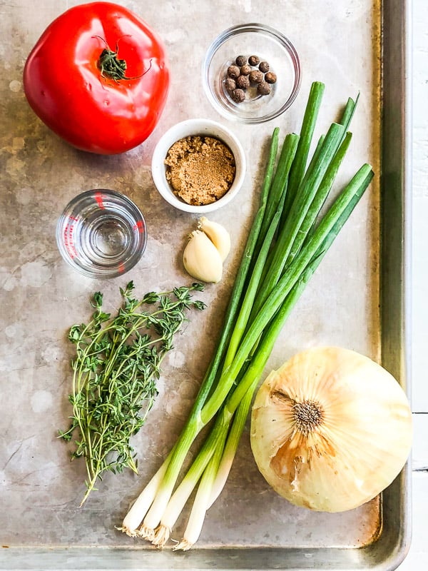 Ingredients for Jamaican jerk sauce on a baking sheet.