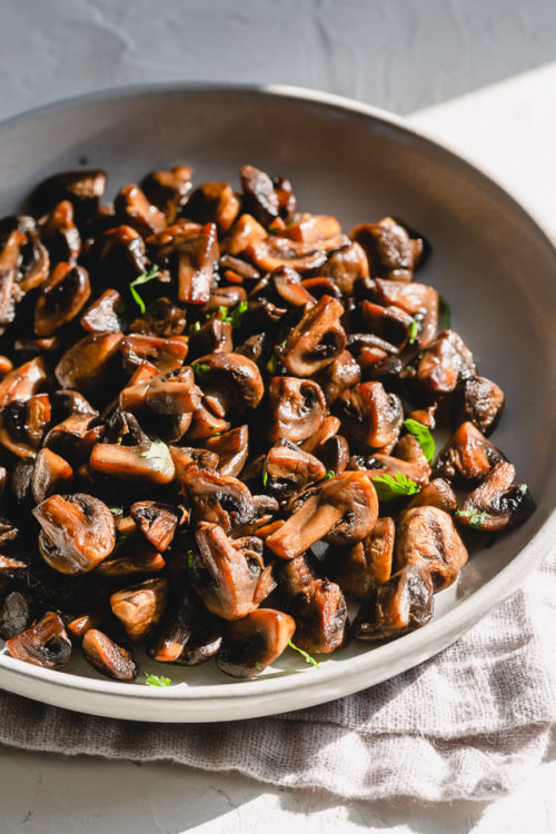 No-fail detailed directions on how to saute mushrooms to achieve that beautifully golden brown, restaurant-quality hearty caramelized mushrooms at home! #mushrooms #howto