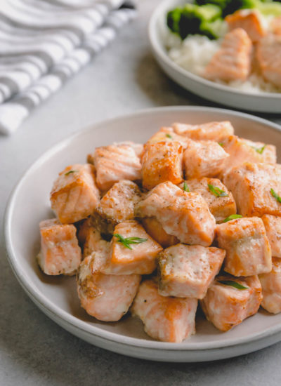 Baked salmon chunks on a serving plate.