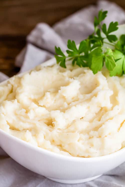 Ultimate mashed potatoes recipe collection. From classic to fancy, from stovetop to crockpot to pressure cooker, from fluffy to creamy, from vegan to loaded, there's every type of mashed potatoes one could request! #mashedpotatoes #sidedish #ThanksgivingSides
