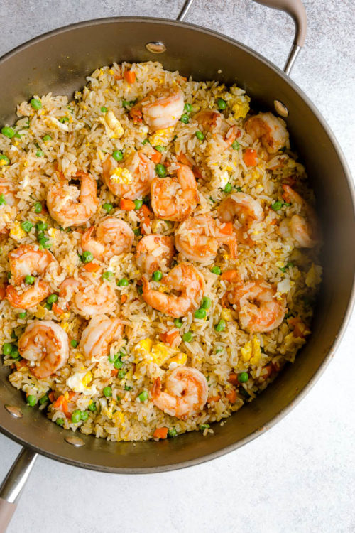 This quick and easy shrimp fried rice is comes together in less than 30 minutes. A family favorite quick dinner recipe for busy weeknights. #friedrice #shrimp #shrimpfriedrice #quickdinner #easyrecipe #busycooks