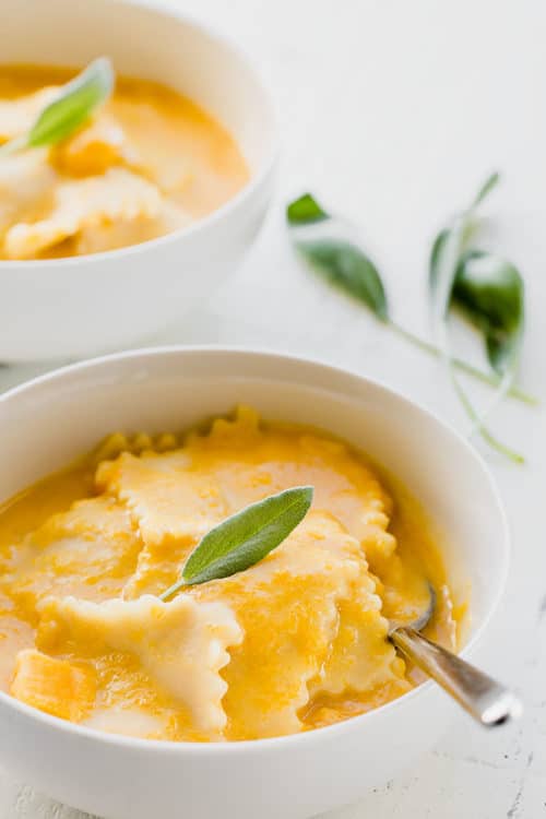 This Instant Pot butternut squash soup with ravioli is a creamy autumn comfort food. From start to finish, it only takes about 40 minutes. And everything comes together in ONE POT! #instantpotsoup #instantpotrecipe #butternutsquashsoup