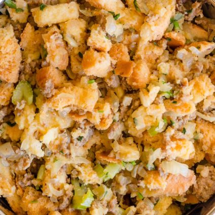 We transformed a classic stuffing recipe into an easy peasy Instant Pot Sausage Stuffing. Generous portions of flavorful fluffy sausage stuffing in less than 1 hour. #instantpotrecipes #instantpot #sausagestuffing #thanksgivingmenu #stuffing 