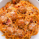 Instant Pot Spaghetti and Meatballs - instant comfort meal with only 3 main ingredients under 30 minutes! Your favorite jar of pasta sauce and frozen meatballs are our secret shortcut to this quick and easy one pot spaghetti meal. It's going to be your family favorite in no time. #spaghettiandmeatballs #meatballs #pasta #quickdinner #easydinner #instantpot #instantpotpasta #busycooks