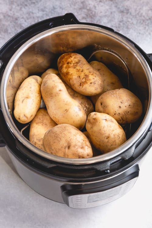 Instant Pot full of russet potatoes to make perfectly creamy and fluffy baked potatoes.