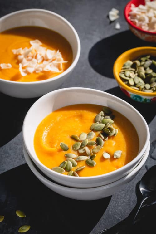 This coconut butternut squash soup is everything you wish for a cozy meal. It's velvety smooth and creamy, hearty with a hint of warm ginger and spices, naturally vegan and absolutely healthy! #butternutsquash #butternutsquashsoup