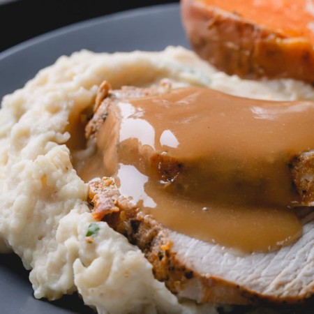 Instant Pot turkey breast, mashed potatoes, baked sweet potatoes, and gravy all in one pot! Yes, you can make an entire Thanksgiving dinner in an Instant Pot all at once! #thanksgiving #instantpotthanksgivingdinner #instantpotturkey