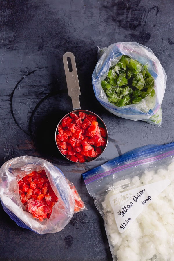 Frozen peppers and onions in a zip top bag and measuring cup for easy Philly cheesesteak sandwiches. 