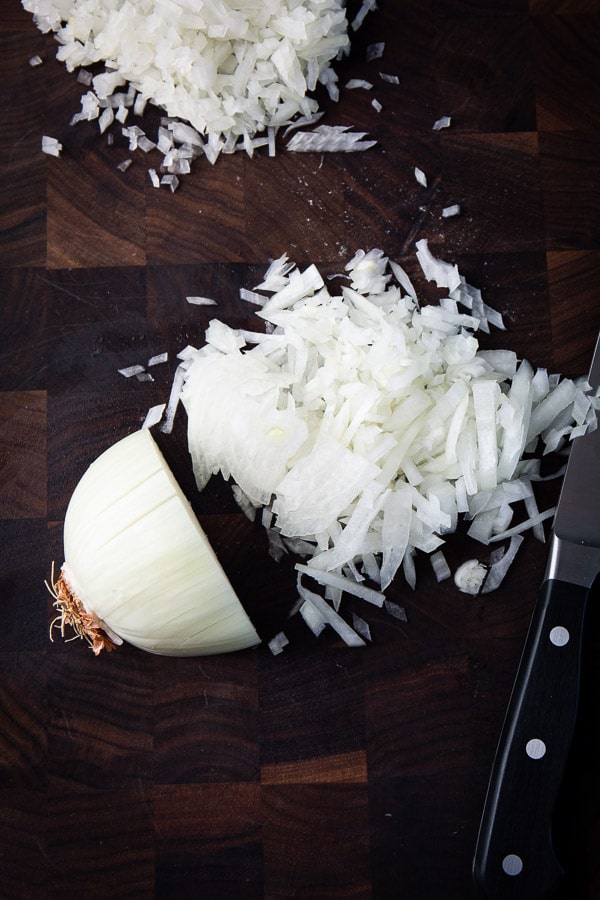 Let me show you how to cut an onion like a pro!! Less tears, beautiful uniform onion slices and/or dices in matter of minutes. #howtotutorial #cookingtip