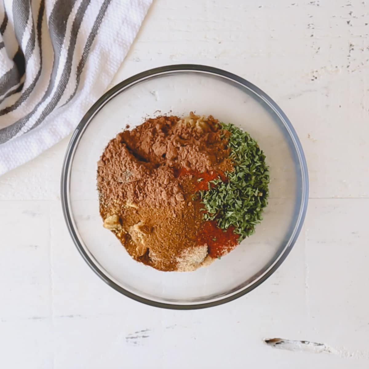 A small bowl of spices for a dry rub.