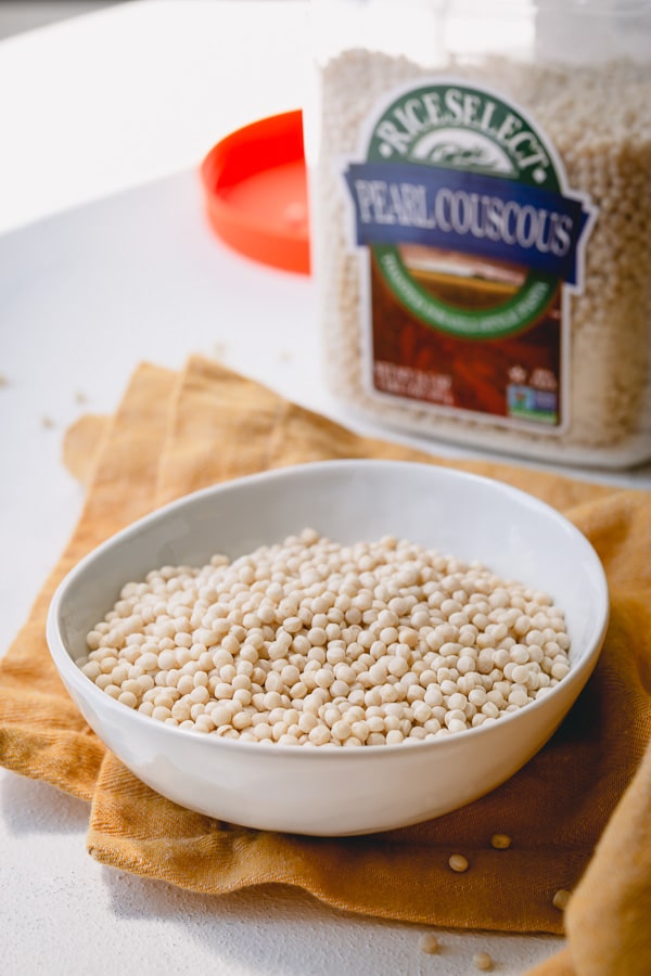 A bowl of uncooked pearl couscous. 