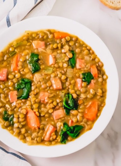 a bowl of lentil soup with ham