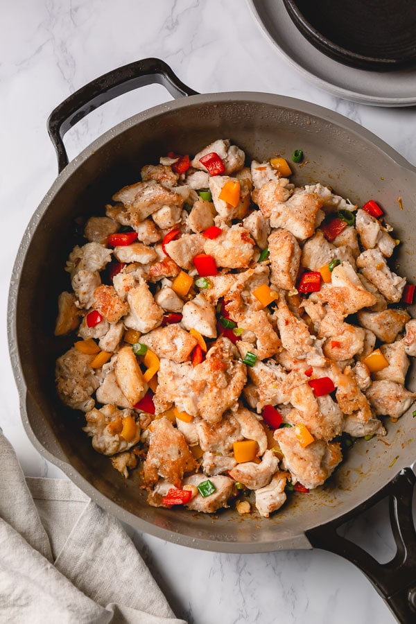 Salt and pepper chicken in a skillet ready to serve.