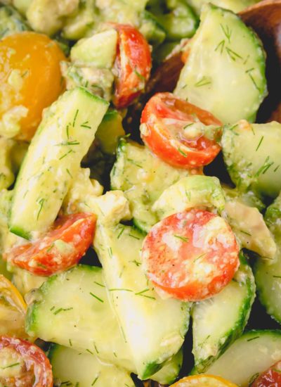 Cucumber salad with cherry tomatoes, dill and avocado.