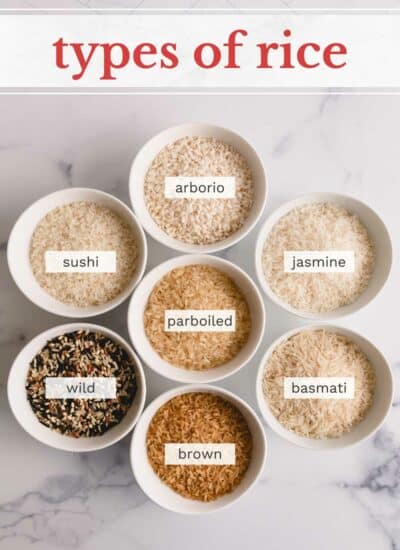 7 types of rice in separate white bowls.