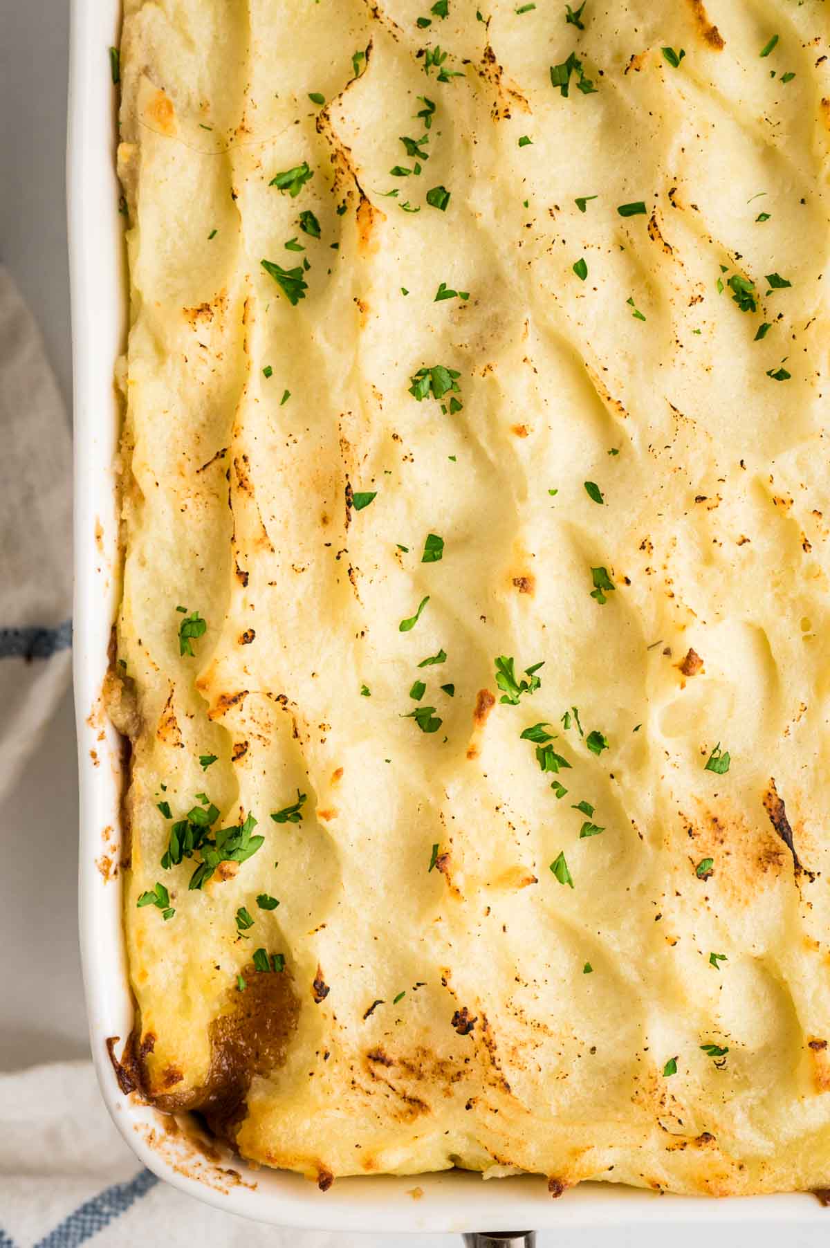 a close up of baked mashed potatoes.