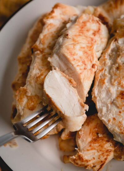 sliced cooked chicken on a plate.