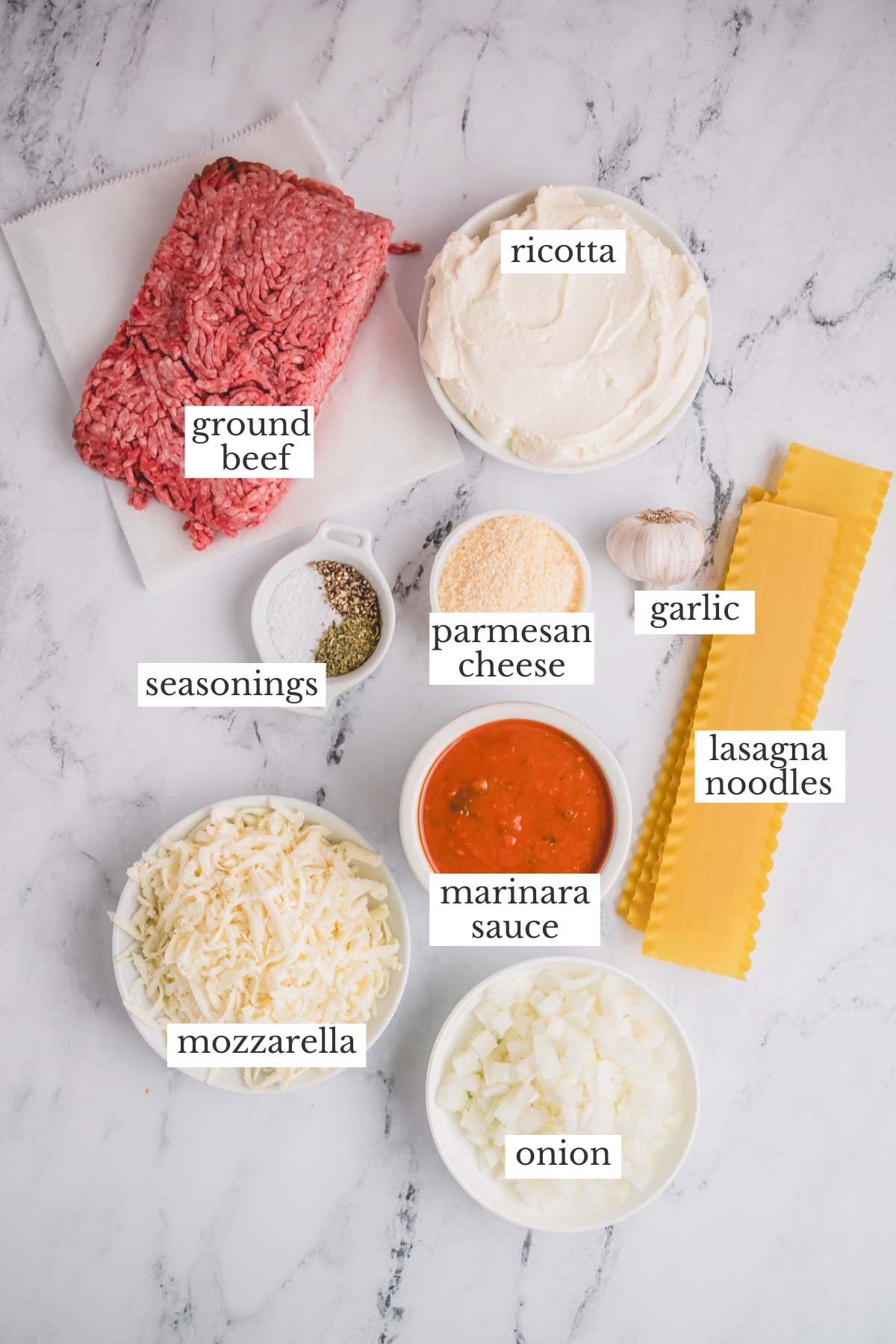 Individual ingredients needed to make slow cooker lasagna.