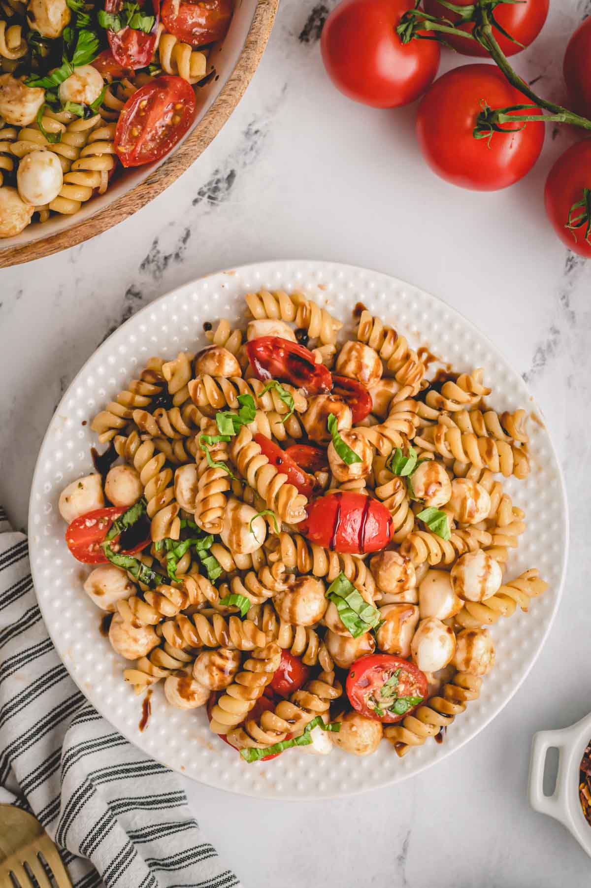 A plate full of homemade Caprese pasta salad.