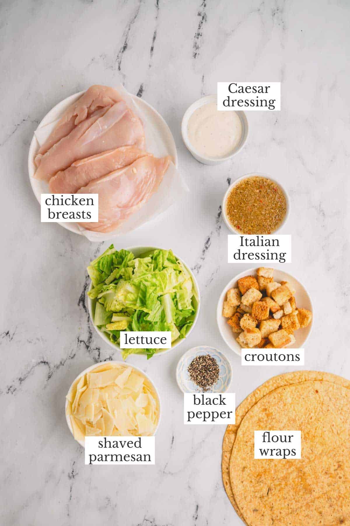 Ingredients needed to make chicken caesar wraps.
