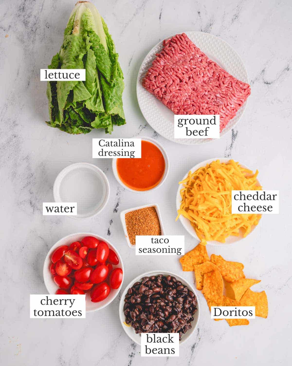 Ingredients needed to make a Dorito taco salad recipe.