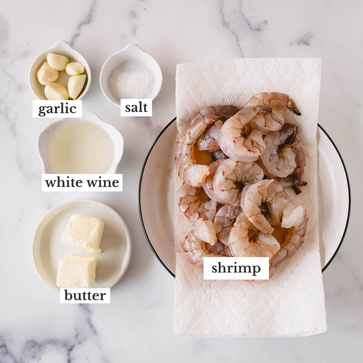 Garlic, salt, white wine, butter, and shrimp to make garlic butter shrimp.