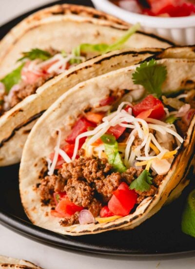 Ground beef tacos on a plate.