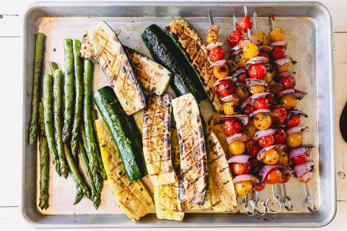 A baking dish with grilled mixed vegetables.