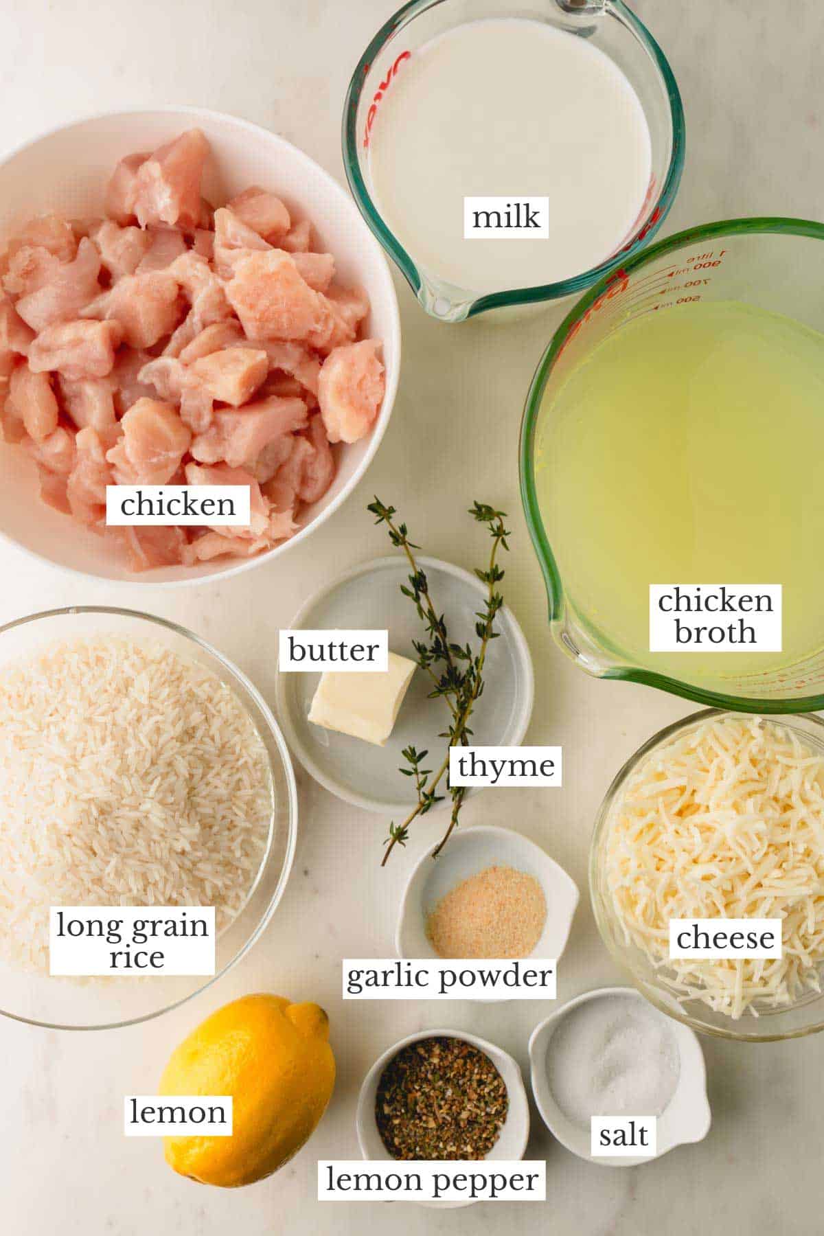 Ingredients to make cheesy chicken and rice casserole with lemon pepper seasoning.