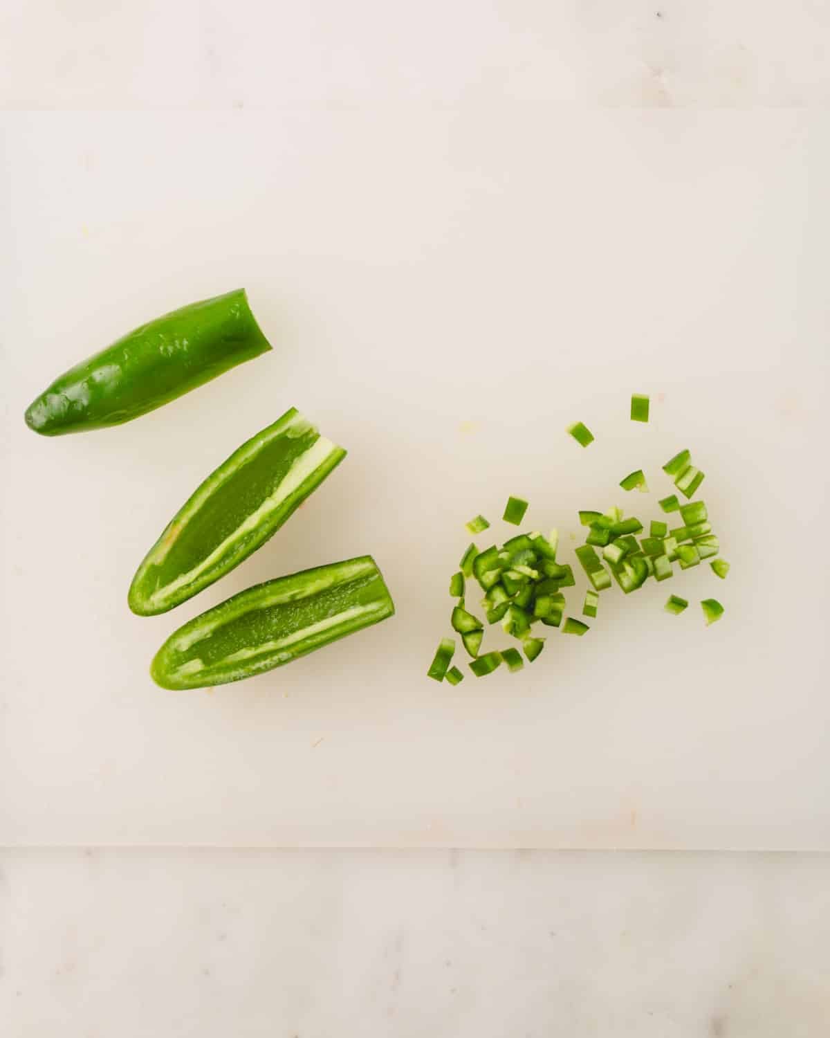 Jalapeno halves are seeded and finely chopped.