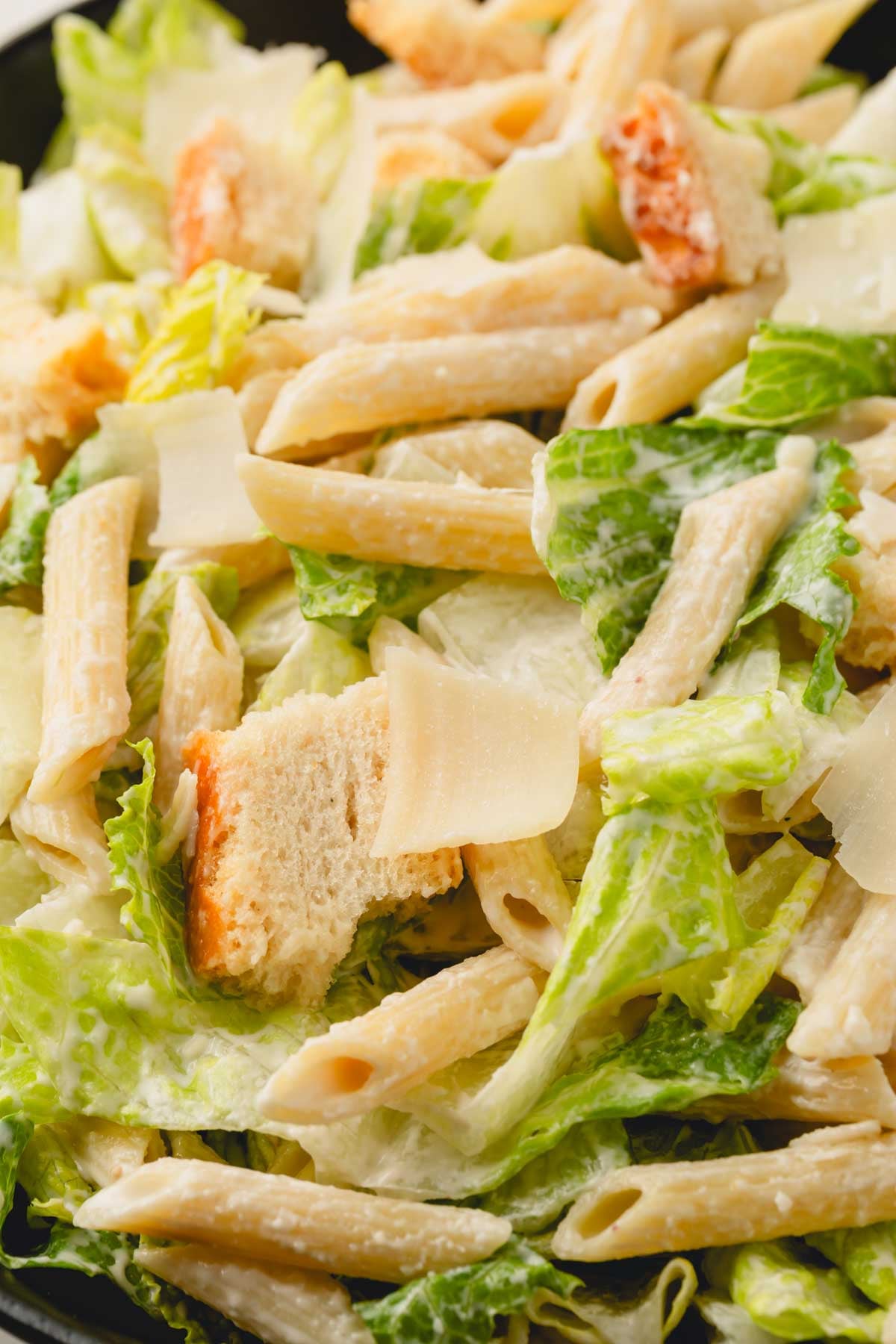 Close up image of finished Caesar pasta salad.