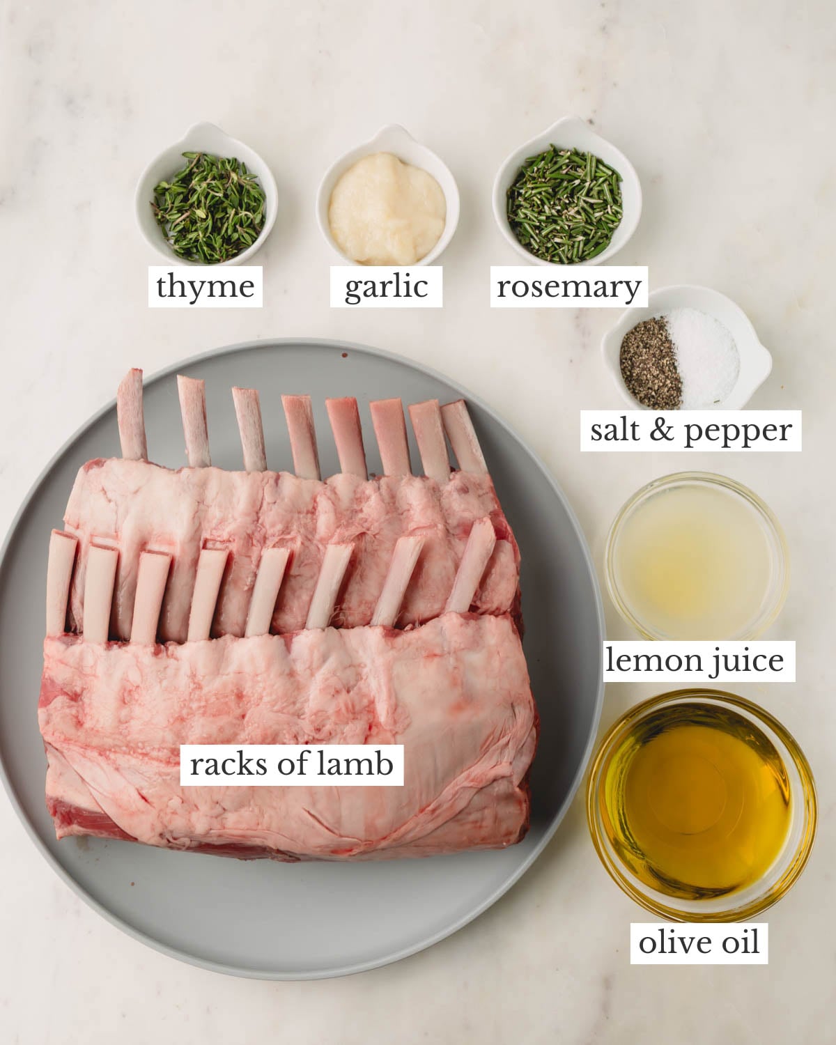 Ingredients for grilled lamb chops which include thyme, garlic, rosemary, salt and pepper, lemon juice, and olive oil.