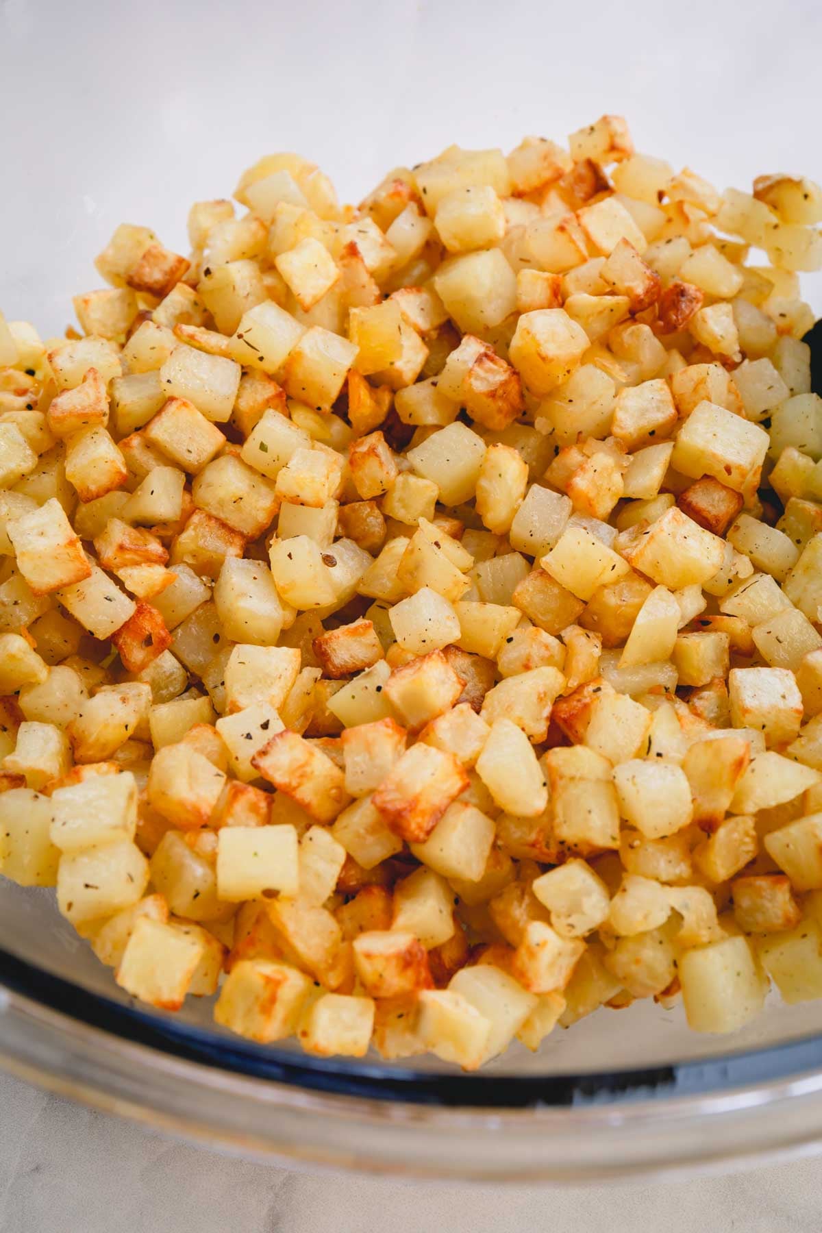 Cooked potato cubes in a large bowl.