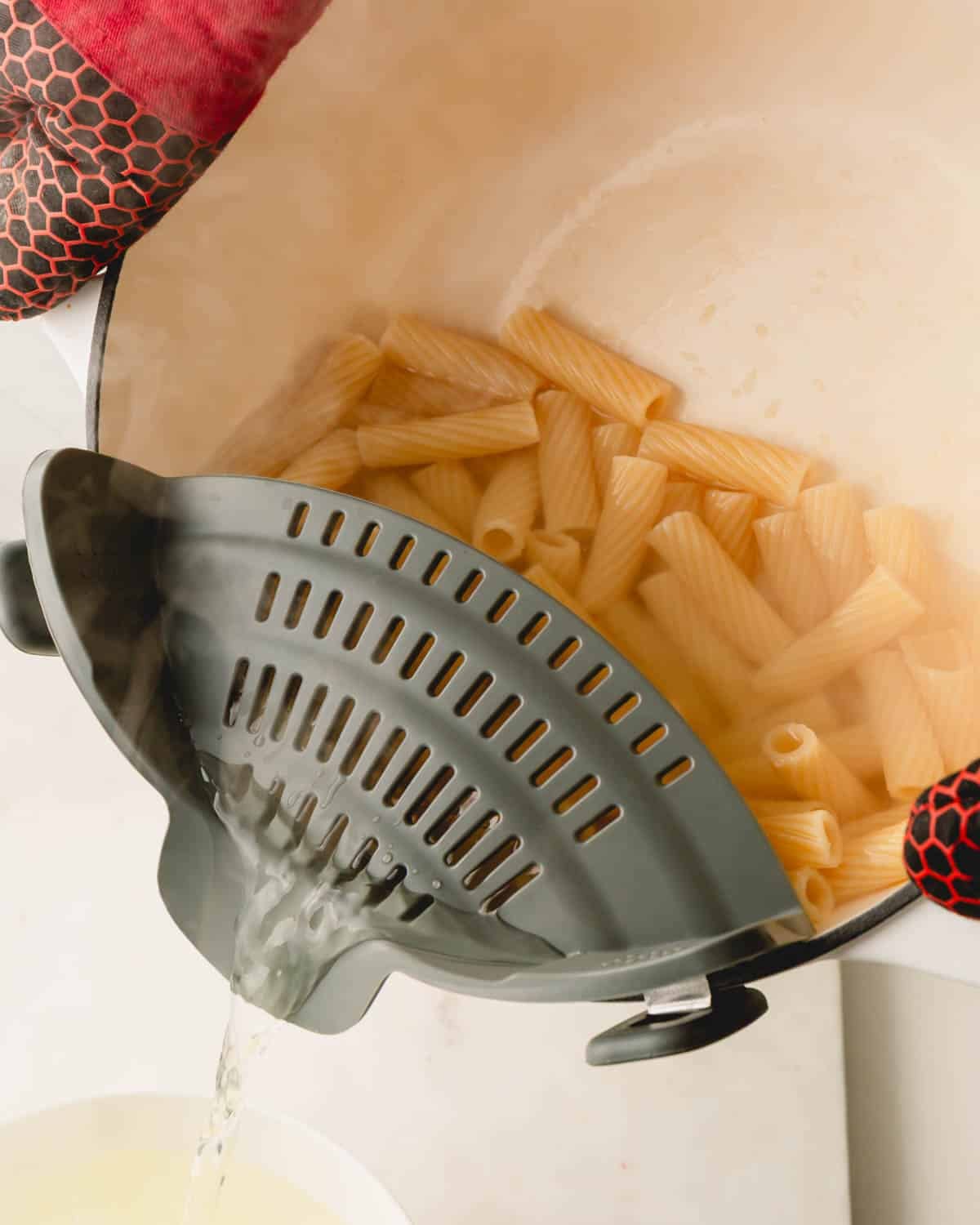 Drain the pasta noodles and reserve the pasta water.