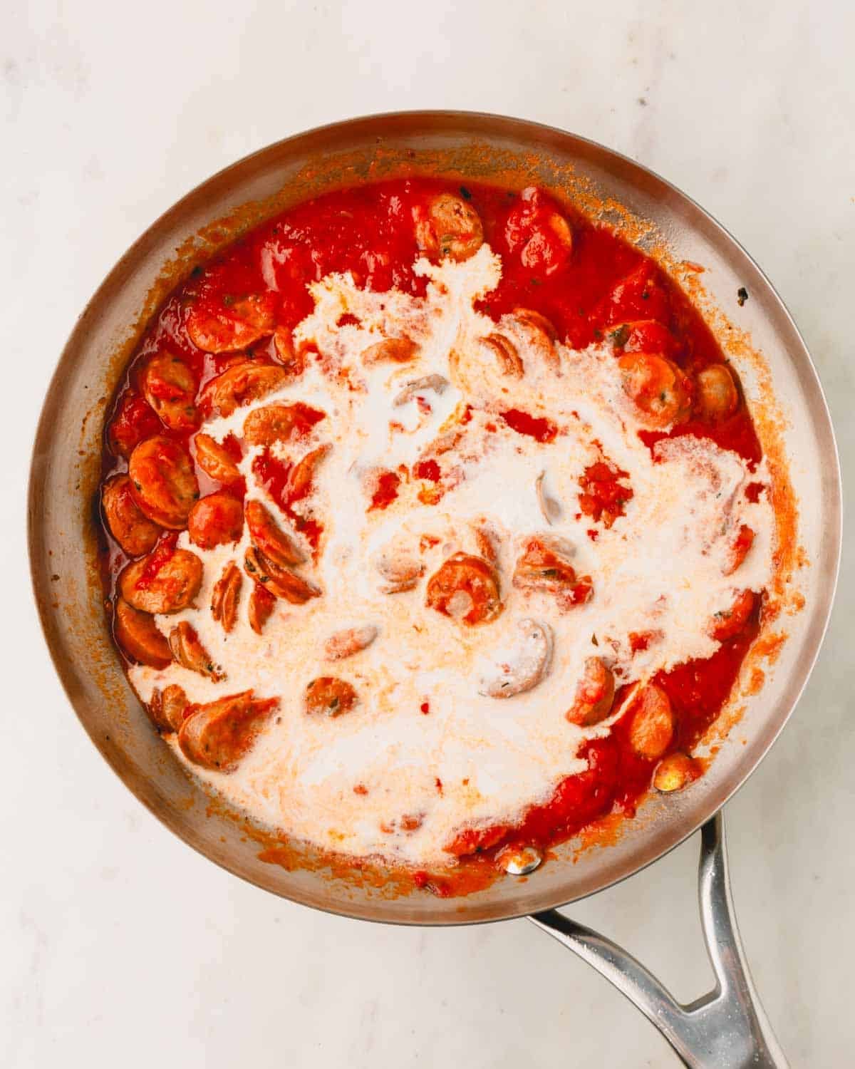 Italian chicken sausage with marinara sauce and heavy cream.