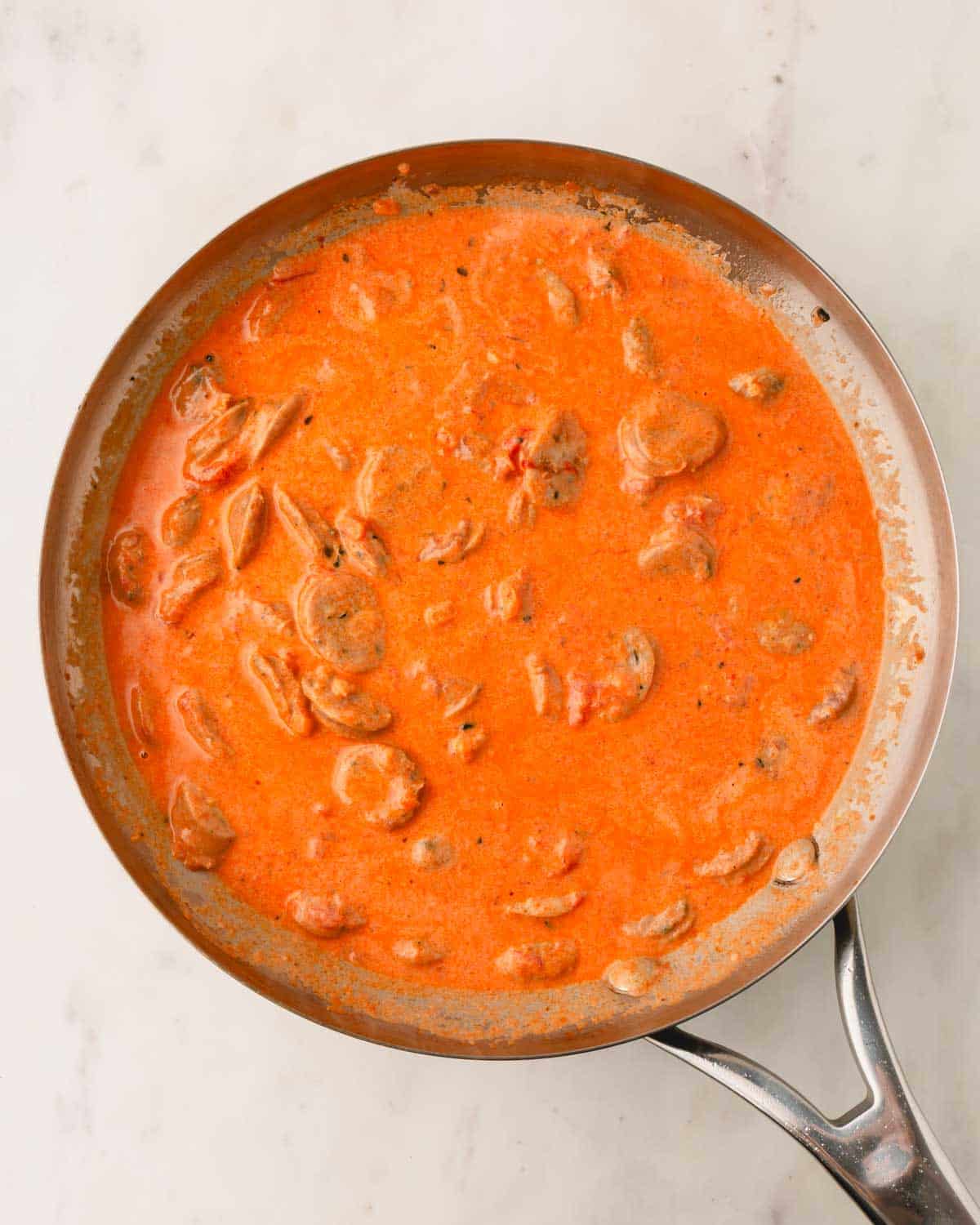 Simmered Italian chicken sausage marinara sauce.