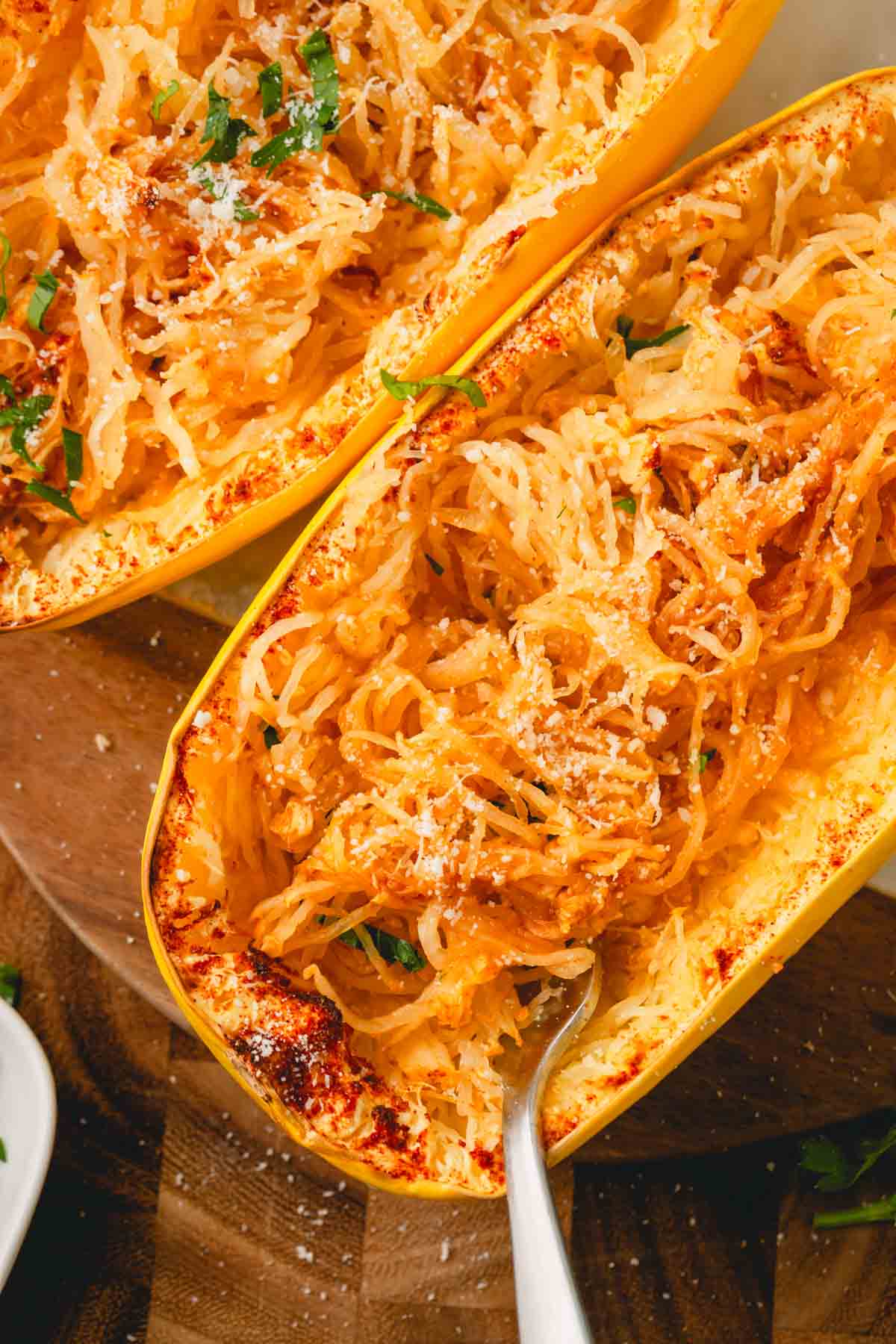 A fork inside of cooked air fryer spaghetti squash.
