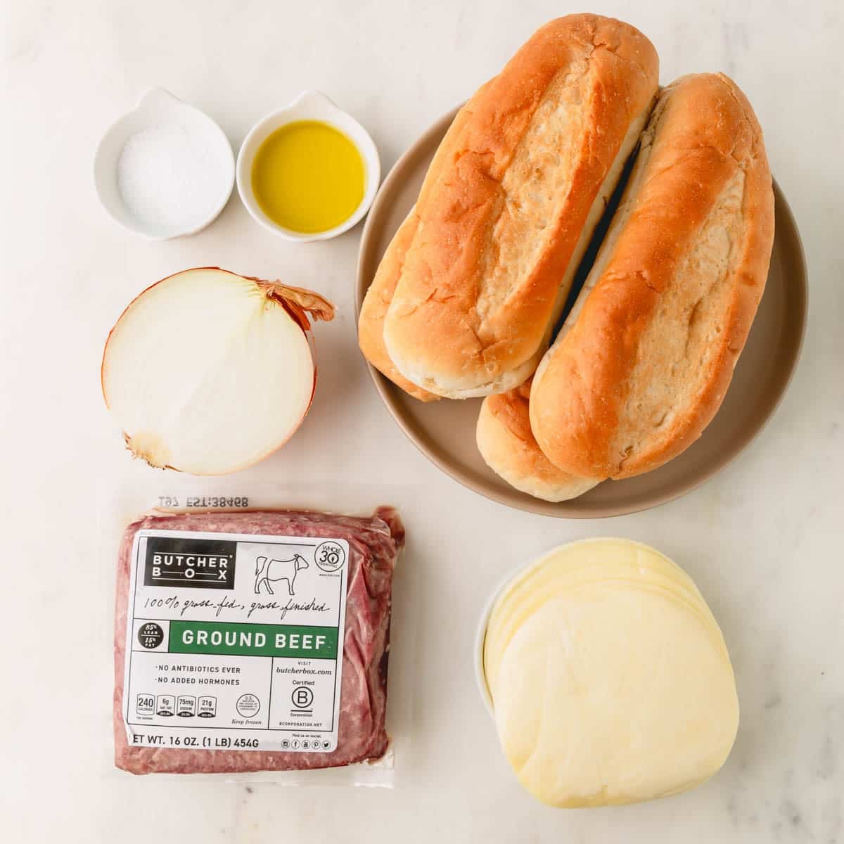 Ingredients for ground beef cheesesteaks.
