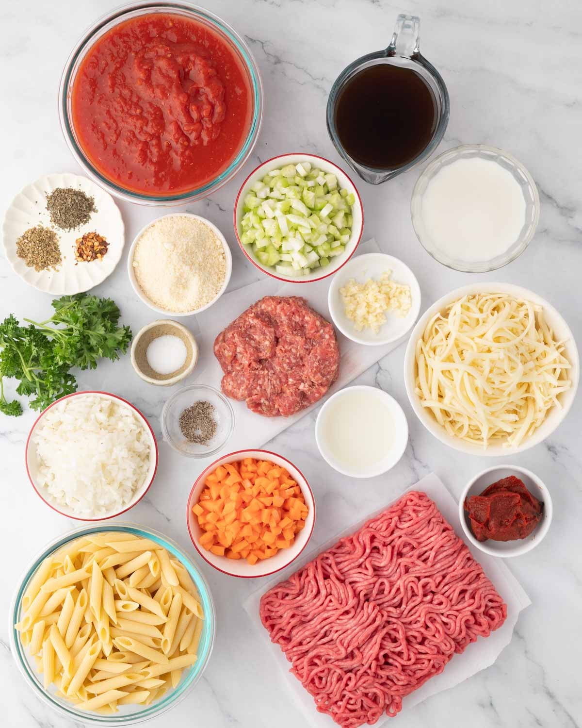 Ingredients for baked pasta bolognese.