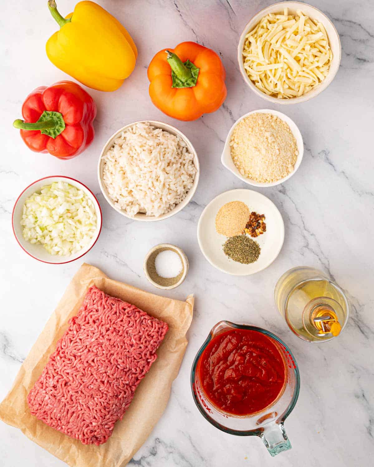 Ingredients for stuffed peppers with ground beef and rice.