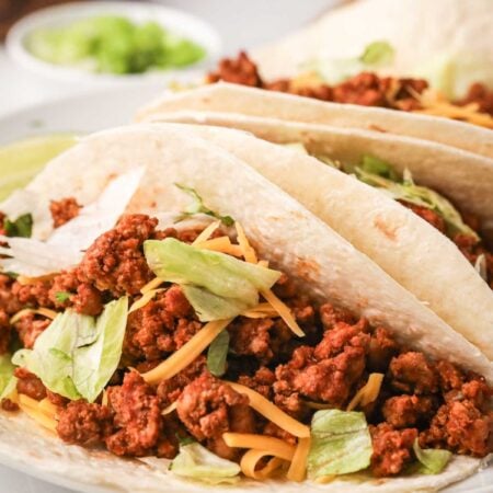 A side view of the inside of a ground turkey taco.
